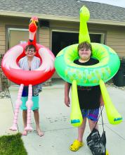 Floaty Friday at the Elk Point Pool from left: Jackson Sharkey the flamingo and Zaden Raber the Dino wear thier floaties. Submitted photo
