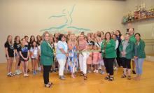 Melissa Strong, shown cutting the ribbon, stands between her mom and daughter to celebrate her dance studio’s 25th anniversary. The Siouxland Chamber of Commerce, plus many 5687! dancers were on hand for the studio’s event on August 5. Photo by Kelly Riibe • times2reporter@gmail.com