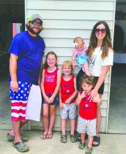 Marica Meins, of Elk Point, can be seen here in this photo with her husband Justin and children all dressed in patriotic attire. Meins is an elementary teacher at EPJ. Submitted photo