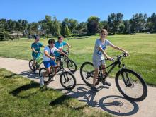 Beautiful weather over Labor Day weekend meant parks and playgrounds were busy. Some DV middle schoolers had fun biking around the Meadows Park, in Dakota Dunes, on Saturday, August 31. From left Andrew Griffus, Eric Wheeldon, Jett Keokenchanh, and Jack Galles. Photo by Kelly Riibe • times2reporter@gmail.com