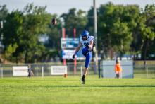 Owen Boyle kicks off during the game against Parker August 23, 2024. Photo by Peterman Sports Photography • stevepeterman5@gmail.com