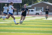 Sophomore Bella Stockes battles a SFC Charger for possession during the DV girls soccer match on Saturday, Sept. 20th. Photo by Peterman Sports Photography • stevepeterman5@gmail.com