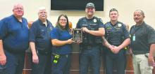 The North Sioux City Fire Department presents the North Sioux City Police Department with an award. From left: Assistant Fire Chief Jim Christenson, Fire Chief Bill Pappas, EMS Director Jackie Rentschler, Officer Levi Saunders, Sergeant Jesse Henrichs, and Police Chief Richard Headid. (not pictured Officer Isaac Wodtke) Submitted photo