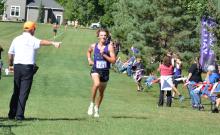 A meet director points Jack Brown towards the finish line as the DV Senior won the race on August 30, 2024. Photo by Kelly Riibe • times2reporter@gmail.com