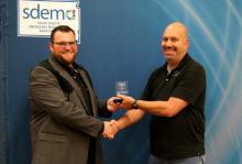Jason Westcott (right) receives an award from the South Dakota Emergency Management Association. Submitted photo