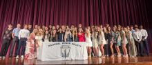 Dakota Valley’s newly inducted NHS members, along with current members, gathered on-stage at the end of the ceremony for a large group photo. Photo by Kelly Riibe • times2reporter@gmail.com