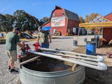 Many had fun at the water tank game and other fun attractions at Adele's Cat Pumpkin Patch. These dads from Sioux City helped work the game with their little ones on Oct. 20, 2024. From left: Dave Mullin, Maggie Mullin, Landon Jordan, and Logan Jordan. Photo by Kelly Riibe • times2reporter@gmail.com
