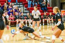 Sammy Kimbell makes a diving pass for the Panthers. Next to her in the backrow is #2 Reagan Granstrom and Coryn Kimbell.