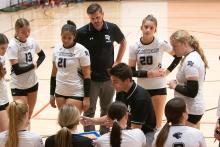 Coach Erik Krenz, in the middle, talks to his Panther volleyball team during a huddle on Saturday, Oct. 19th. Photos by Peterman Sports Photography • stevepeterman5@gmail.com