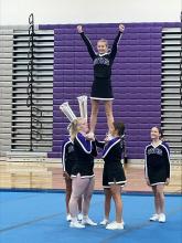 Samantha Nelson gets lifted by her Panther competition cheer teammates on Saturday, October 12th.