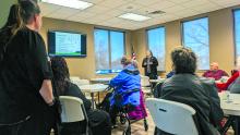 Maggie Jennings, a Risk Management and Fraud Prevention Officer with First Dakota in Sioux Falls visits with residents about fraud trends. Photo by Kelly Riibe • times2reporter@gmail.com