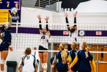 A double threat at the net are DV’s Aubree Worden (#20) and Emersen Mead who block well to continually give their opponents trouble. Photo by Peterman Sports Photography • stevepeterman5@gmail.com