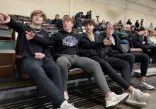 Dakota Valley Juniors cheer on classmates as the Metros battle the Omaha Jr Lancers, from left: Bennett Lukken, Jake Pick, Luke Anema, and Grady Ramos.