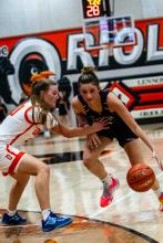 Aubree Worden dribbles around the defender from Lennox on December 10, 2024. Photo by Peterman Sports Photography • stevepeterman5@gmail.com
