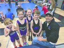 Panther Wrestling had many youth grapplers participate in the Elk Point-Jefferson tournament on Sunday, January 26, 2025, from left: Luka Verdoorne, Violet Reis, Kash Knowlton, Leo Riibe, and Coach Adrian Jurado. Photo by Kelly Riibe • times2reporter@gmail.com