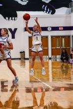 Sophomore Bella Stokes put up an outside shot for the Panthers versus Hartington’s Cedar Catholic High School . Photos by Peterman Sports Photography • stevepeterman5@gmail.com