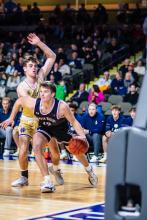 Senior Drew Lukken dribbles past his Heelen defender on Saturday, Dec. 21st.