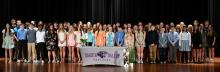 Current and new members of DV’s National Junior Honor Society gathered on stage after the March 3rd induction ceremony. Photo courtesy of Squier Designs