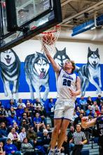 Grayson Girard takes it to the hoop for the Huskies in the game versus Beresford. Photo by Peterman Sports Photography stevepeterman5@gmail.com