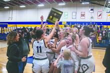 The DV Panther’s girls basketball team celebrates as they hold the award plaque proudly. Photos by Peterman Sports Photography • stevepeterman5@gmail.com