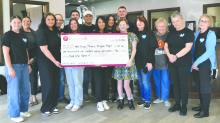 A large crowd was present at Peoples Bank to celebrate “Kind Like Karlee” and the generous donation to New Stage Players Penguin Project on March 25, 2025. Back row from left: Payton Hinrickson, Cody Juffer, Ryan Hughes, Shannon Hughes, Aly Radtke, and Koel Radtke. Front row from left: Ryann Coughlin Molly Pirner, Carrie Smith, Missy Hughes, Evelyn H., Kristy Tremayne, Deb Morgan, Janice Graves, and Rose Bates. Photo by Kelly Riibe • times2reporter@gmail.com