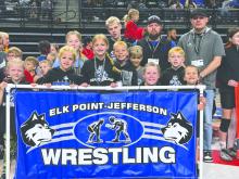 The Huskies carried a banner in the parade of teams for the 2025 youth state wrestling tournament in Rapid City. The parade took place on Sunday, March 30, 2025 prior to the medal round matches.