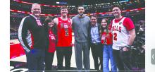 Chicago Bulls professional basketball player, Lonzo Ball, met with family members of Alex Reinhardt prior to his NBA game on Wednesday, April 9, 2025. From Left: Carl Reinhardt, Angie Reinhardt, Seth Reinhardt, Lonzo Ball, Dr. Brian Cole, Kia Gjoraas, and Cole Reinhardt. Submitted photo