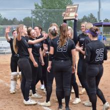 Surrounded by teammates and coaches, Panther senior Addie Dickson holds up DV’s state qualifier plaque for 2025. The Panthers will play their first game of the high school state softball tourney in Aberdeen on Thursday, June 5, 2025. Photos by Kelly Riibe • times2reporter@gmail.com