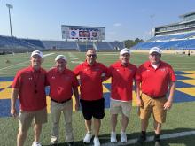 “It was an absolute honor to be selected as the head coach in the All-Star Game. Got to work with some great coaches and meet some awesome young men. Best was the opportunity to get to coach Keaton, Hudson, and Ashton one more time before they move on to their collegiate teams. Definitely an experience I won’t forget,” commented Jake Terry. Coach Jake Terry, third from the left, with other coaches from the All-Star Football Game on Saturday, June 7, 2025. Submitted photo