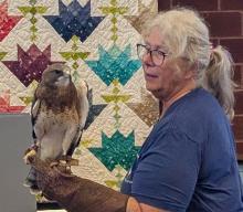 Representatives from Fontenelle Forest, out of Bellevue, Nebraska, were at North Sioux City’s library on July 8, 2025 to give a raptor presentation. Photo by Kelly Riibe • times2reporter@gmail.com