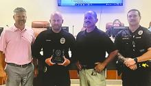 Officer Faustin Mahlke is honored by city officials and fellow officers on Sept. 16 for 10 years of service with the North Sioux City Police Department, recognizing his dedication to public safety, community outreach, and emergency response. From left: Mayor Chris Bogenrief, Officer Faustin Mahlke, Police Chief Richard Headid, and Sergeant Jesse Henrichs.  Submitted photo