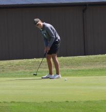 Spencer Marx lines up his putt during EPJ’s golf meet at Two Rivers Golf Club in Dakota Dunes. Photo by Kelly Riibe • times2reporter@gmail.com