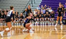 Senior Samantha Kimbell gets low to make the pass for DV in their match versus Yankton.