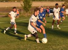 Landen Adams makes a play on the ball for Dakota Valley in the roster’s match versus the WC Trojans. Cruz Trejo, #4 for the Panthers, and Yahya Luqman, #10 for DV, are nearby to help. Submitted photo