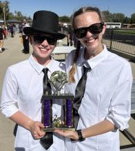 Drum Major Mia Riibe and Guard Captain Danica Euliss accepting the 2nd place trophy. Submitted photo