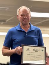 Shawn Tabke presents the Union County 4-H Community Service Award to the commissioners in recognition of their support of the 4-H program. The award honors the board’s commitment to youth development and community service through 4-H initiatives.