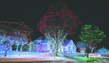 Lights wrap a home on West Pinehurst Trail in Dakota Dunes, adding color and warmth to the neighborhood’s holiday season. Photo by Kelly Riibe • times2reporter@gmail.com