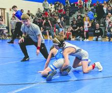 Ezra Fischer, of Elk Point, works for points during his tournament match on January 25, 2026. Fischer is seen here in the top position with head gear. Photo by Kelly Riibe • times2reporter@gmail.com