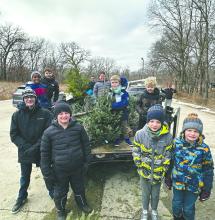 Scouts from Troop and Pack 28 gather Christmas trees across Dakota Dunes on Jan. 3. The trees were delivered to the Dorothy Pecaut Nature Center, where they will be chipped into mulch for use along the park’s hiking trails this spring.