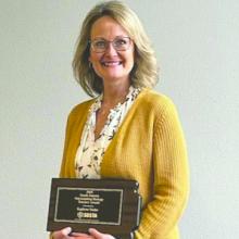 Elk Point‑Jefferson teacher Karlene Stabe holds her award after being named the 2026 Outstanding Biology Teacher by the South Dakota Science Teaching Association.