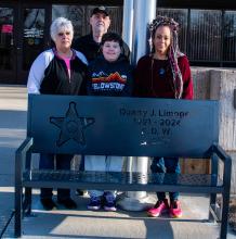 Pam Limoges, Luke Limoges, Isaiah Limoges, and Lakisha Klinger gathered on Friday, February 13, outside the Union County Courthouse in Elk Point for the dedication of a memorial bench honoring longtime Sheriff Dan Limoges on the second anniversary of his passing. Photo by Peterman Sports Photography • stevepeterman5@gmail.com