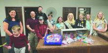 From left: Kelli Kappenman, Thomas Kappenman, Police Chief Jacob Limoges, Officer Austin Edwards and members of Girl Scout Troop 161 are pictured as the troop delivers the sensory bags they assembled for the Elk Point Police Department. Submitted photo