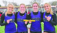 The Panther girls 4x200m relay team broke the school record and bested all classes to claim gold on April 11, 2026. From left: Millie Squier, Mallory Riibe, Emma Honner, and Ava Squier. Photo by Kelly Riibe • times2reporter@gmail.com
