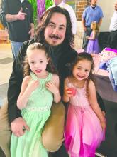 James Chicoine and his daughters, Aubrey and Kaylee, enjoy the Daddy Daughter Dance at Dakota Valley on March 28. Submitted photo
