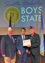 Carter Heckathorn is presented with his certificate recognizing his selection as a South Dakota Boys State Supreme Court justice during the 2025 session. Submitted photo