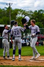 Sterling Schauff, #8 for DV, is congratulated for his home run by teammates, from left Noah Graham and Grady Ramos. Photo by Peterman Sports Photography • stevepeterman5@gmail.com