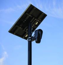A Flock Safety automatic license‑plate reader similar to the units installed along Union County’s highway cor‑ridors. The cameras capture license plates, vehicle de‑scriptions and time‑stamped metadata for law‑enforce‑ment use.