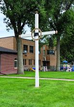 This is one of the three 'Grasshopper Crosses' in Jefferson, South Dakota. This one is located near St. Peter's Community Center on Main Street.