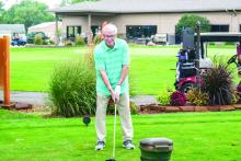 Honorary Chairman Dick Connors gets ready to take his first swing to start the 2026 Farmer’s Open Tournament, in Elk Point, on Friday, August 7, 2026.