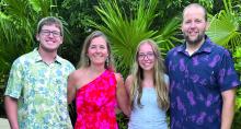 Newly appointed Dakota Valley High School Principal Jeff Hamm, right, poses for a photo with his family, from left, son Ethan Hamm, wife Jesica Hamm, and daughter Elizabeth Hamm. Jeff Hamm officially assumed the high school principal role on July 1, marking his 20th year with the district. Submitted photo